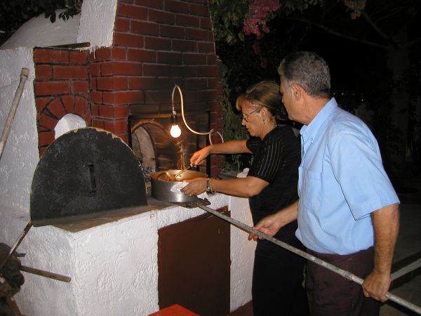 Maria & Niko preparing giouvetsi